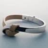 Pulseira Ormé Edition em prata rodiada com couro cinzento-acastanhado